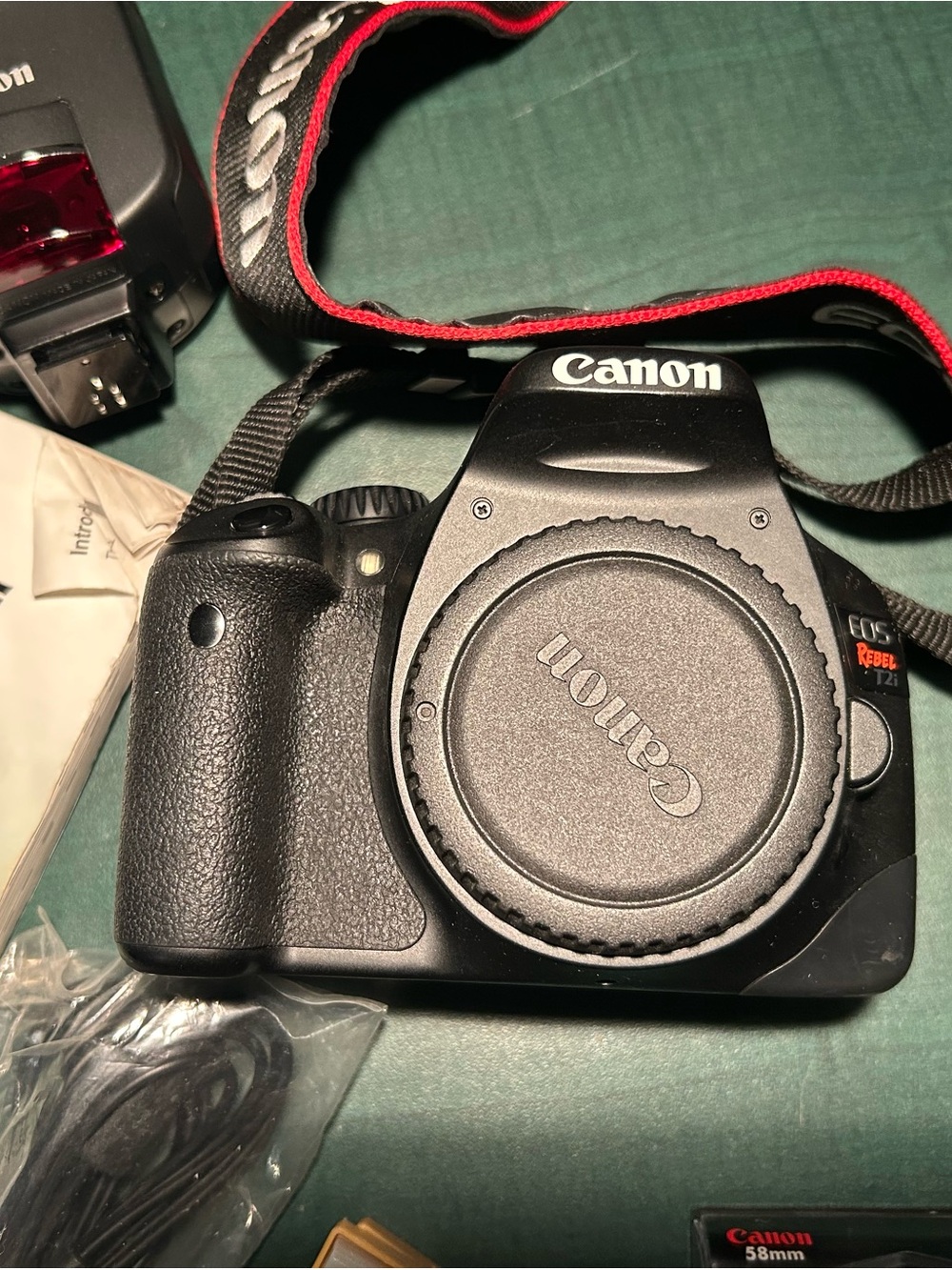 Canon DSLR Camera Body with Black and Red Strap plus accessories
